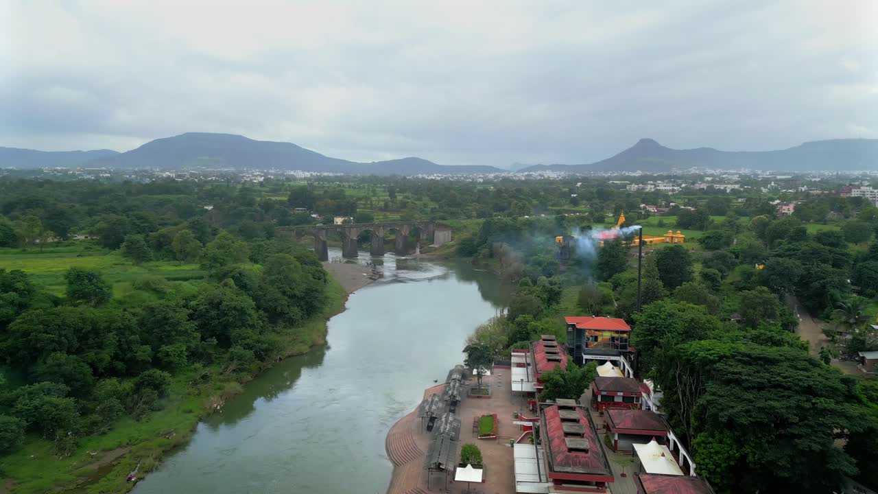 smoke coming out by cremation centre near at Krishna river satara drone view