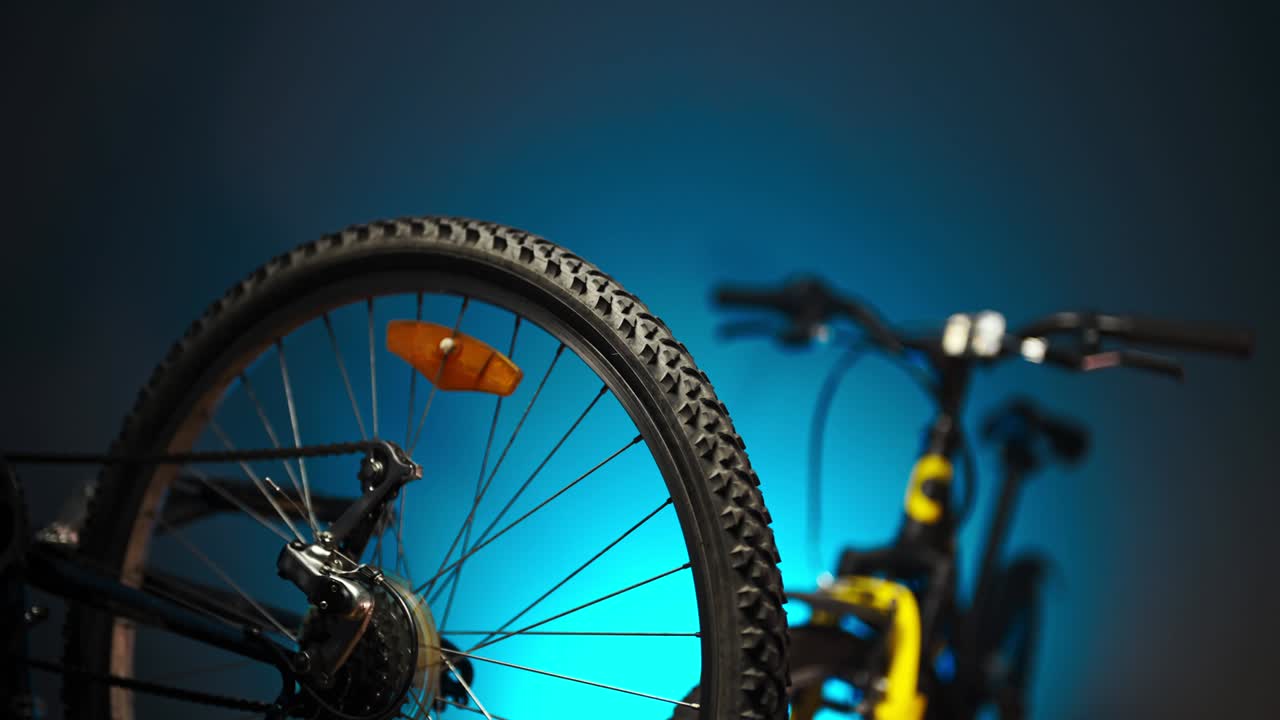 Bicycles stand in a workshop with led lights.