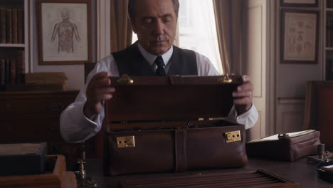 vintage doctor opening his briefcase