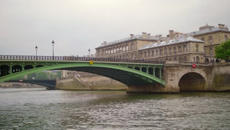 seine river and bridge near notre dame de paris cathedral after sunset