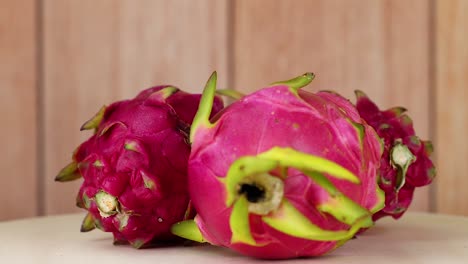 dragon fruits arranged on a wooden background