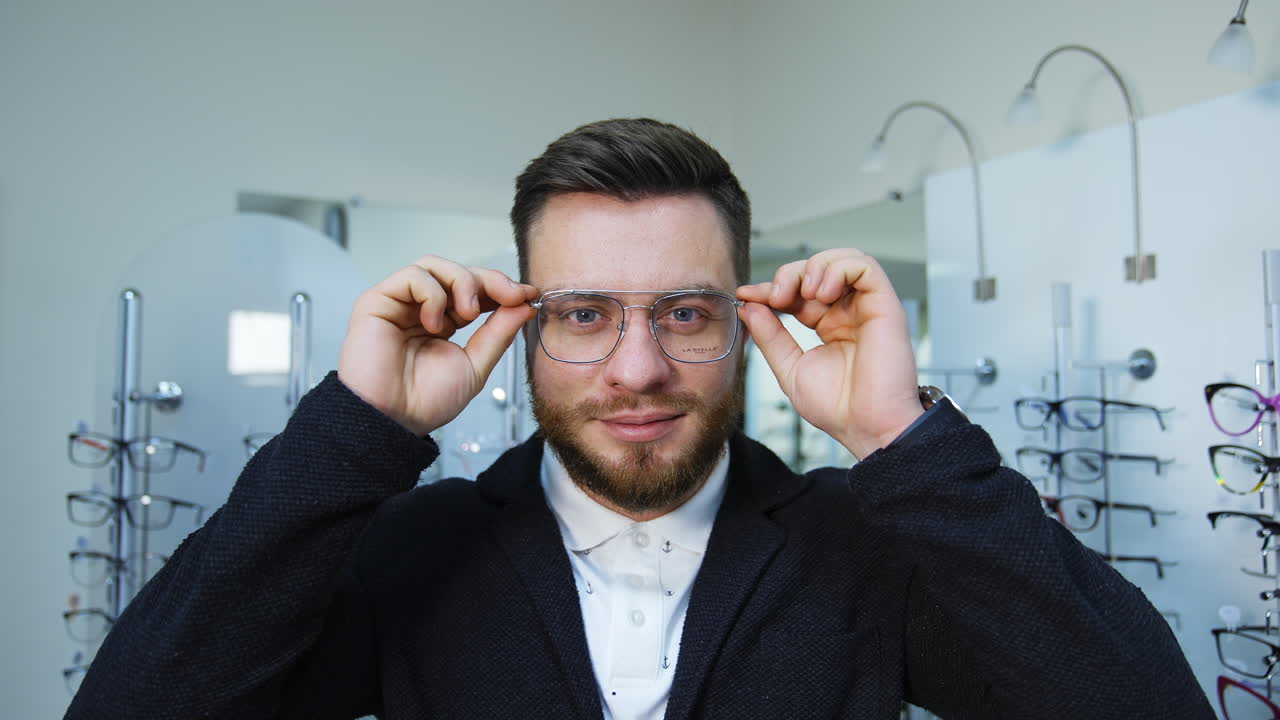 Man trying glasses at store. Portrait of man doing visual examination at optical center