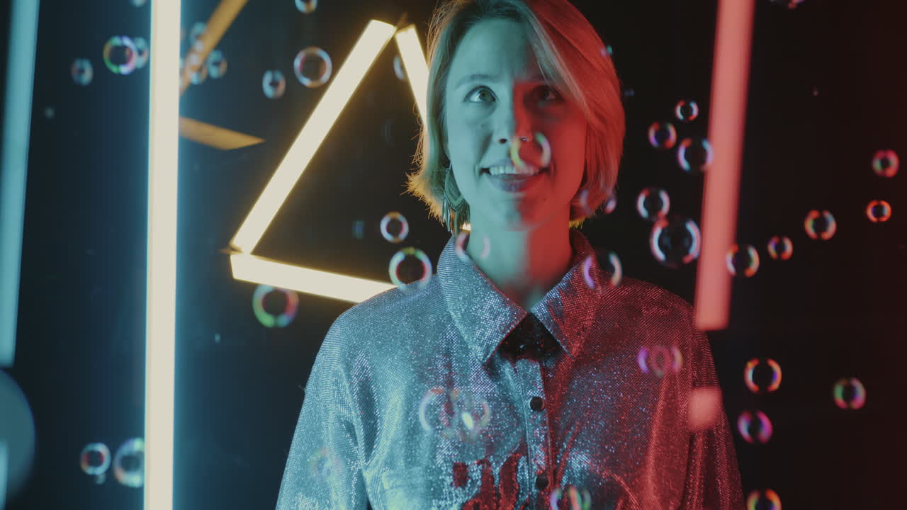 Woman surrounded by colorful bubbles and neon lights