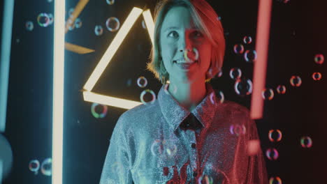 Woman surrounded by colorful bubbles and neon lights