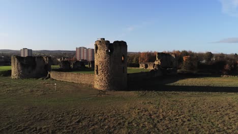 ancient flint castle medieval heritage military welsh ruins aerial view landmark slow forward push in