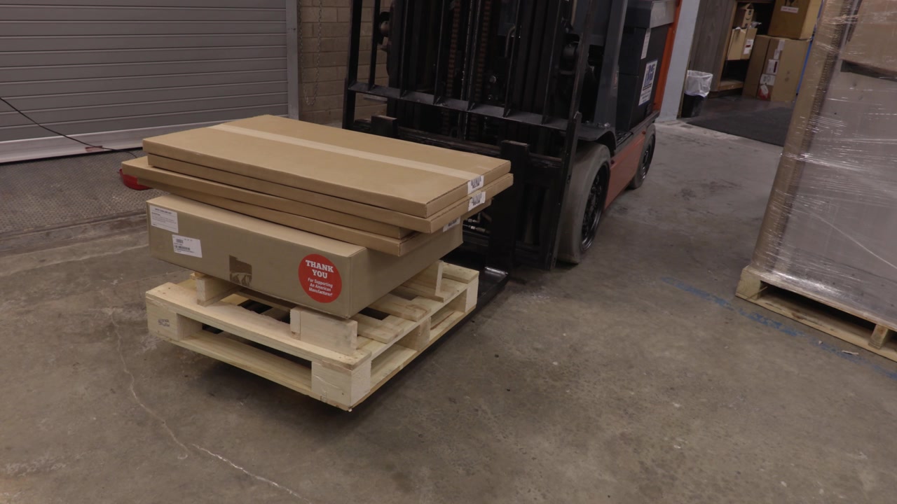 Stationary Shot of Pallet and Boxes on a Forklift