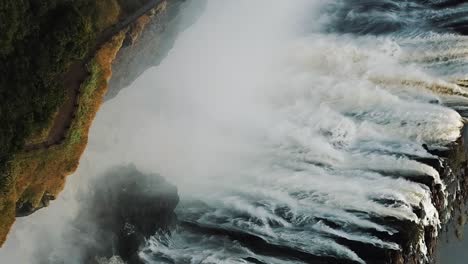 vertical aerial view victoria falls, shungu namutitima at the border of zimbabwe and zambia in africa