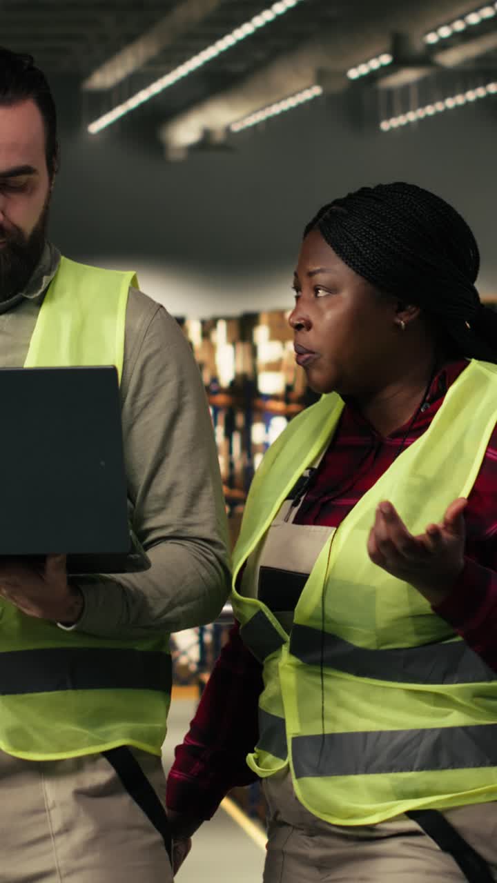 Vertical Video Diverse workers handling packages and updating tracking systems