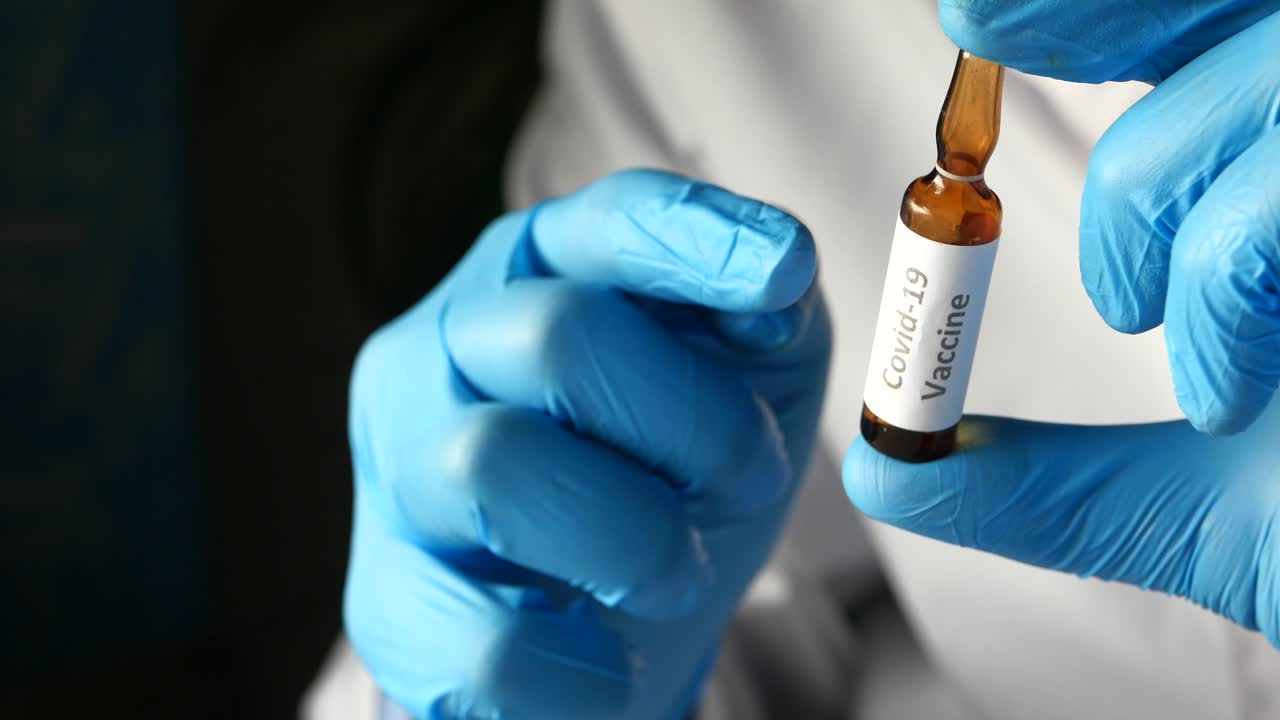 Covid-19 Vaccine in Doctor's Hands