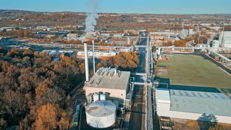 aerial footage moving towards a large industrial chemical plant, in the uk