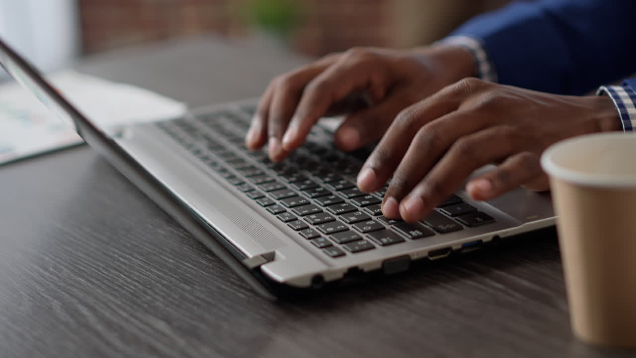 Company manager working with project information on laptop