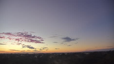 diagonal tilt down revealing tambopata jungle covered in mist at sunrise