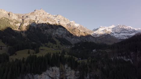 Aerial-shot-of-high-mountains-peaks-at-the-end-of-the-day