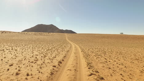 long empty desert track in namibia