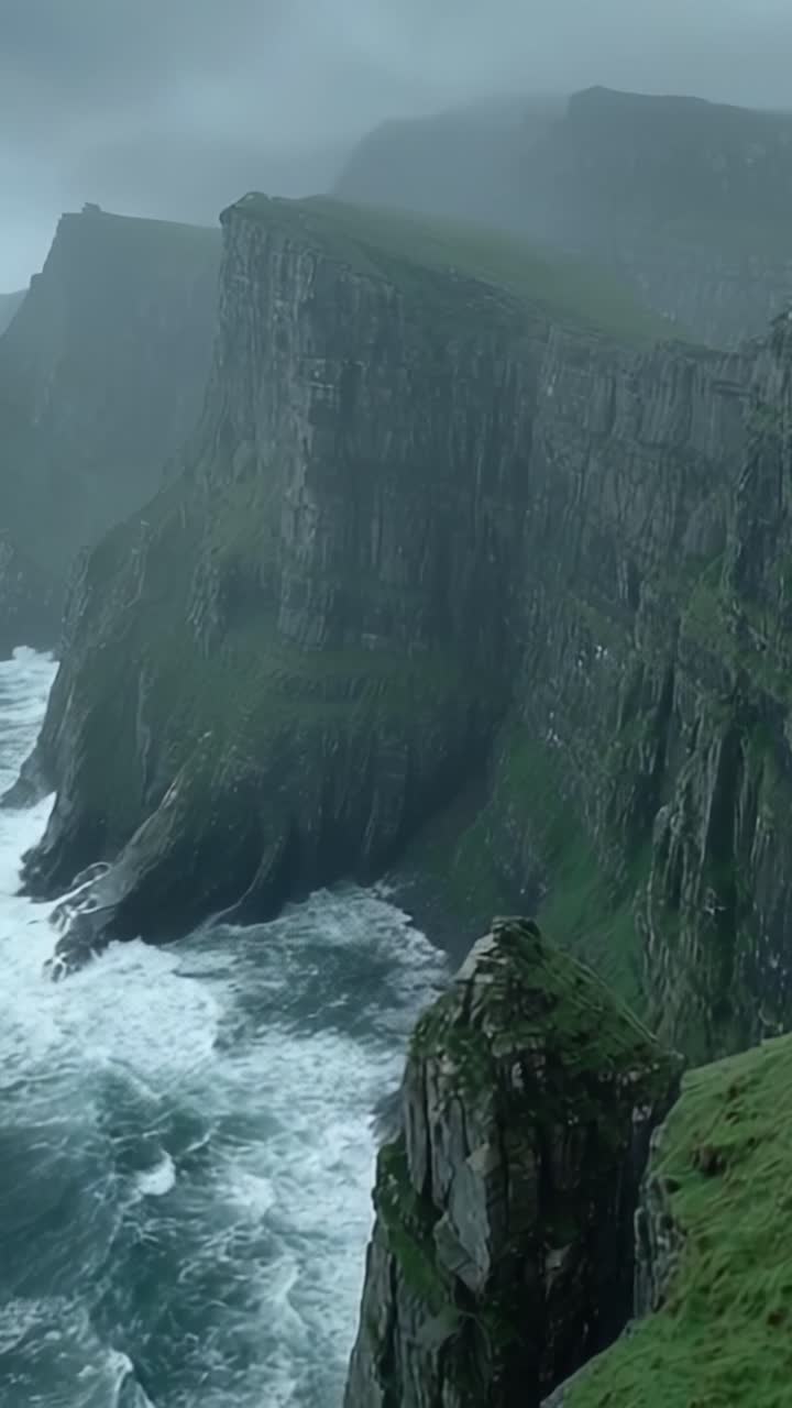 Dramatic Coastal Cliffs Overlooking Turbulent Ocean Waves in a Misty Landscape, Captured in a Stunning Visual Journey of Nature's Majesty
