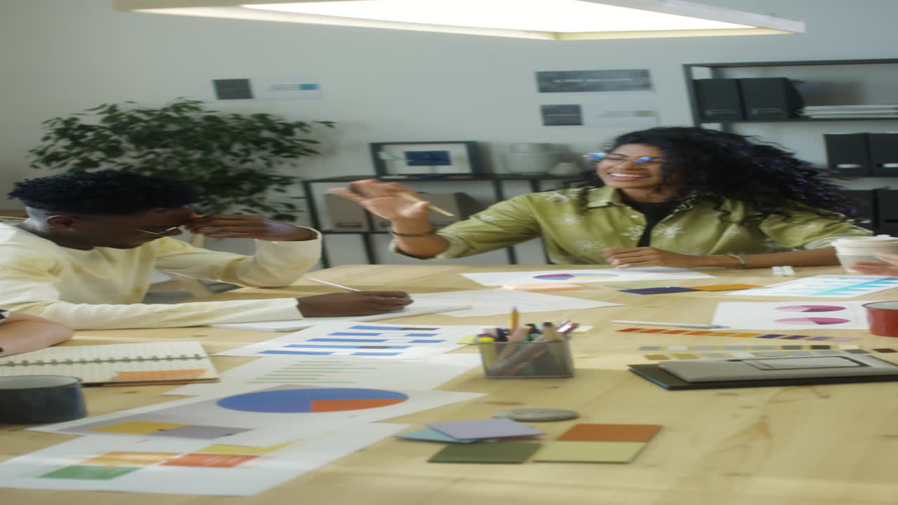 Team Smiling and Talking on Office Meeting