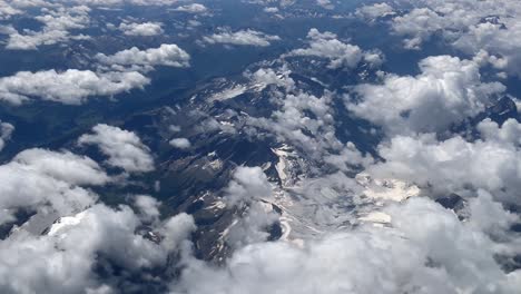 aerial view of the alps mountains with clouds