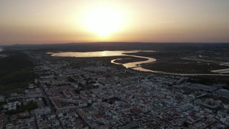 Aerial-View-of-the-Coastal-village-of-Vila-Real-Santo-Antonio-at-Sunset