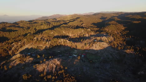 Aerial-shot-of-houses-on-the-rocky-mountains-of-Nebaj,-Quiche-in-Guatemala,-during-the-morning