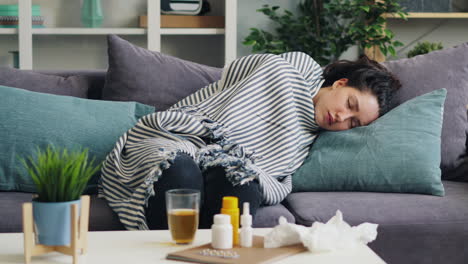 woman sick on couch