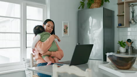 Laptop,-remote-work-and-a-mother-holding-her-baby