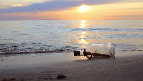 Message-in-the-bottle-against-the-Sun-setting-down