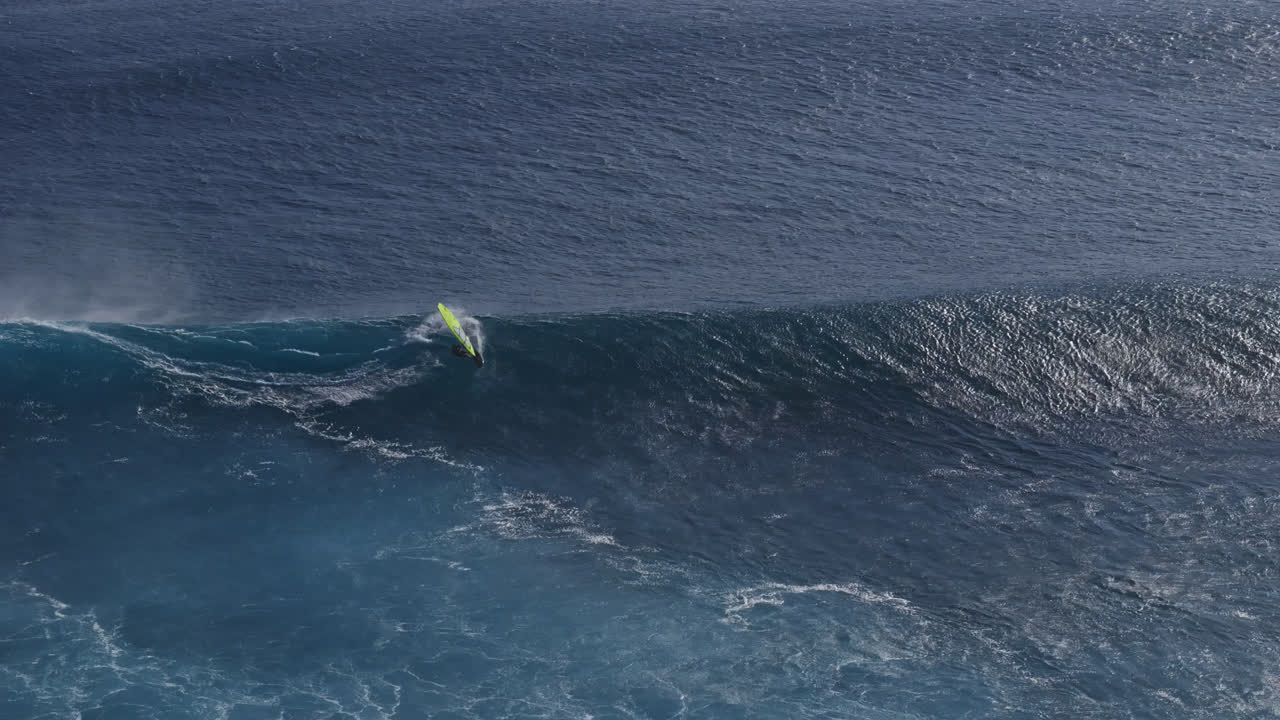 Windsurfer Riding a Giant Wave