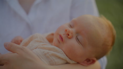 smiling newborn in sunset close-up