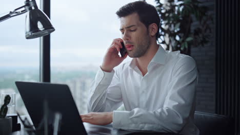 manager looking at smartphone screen