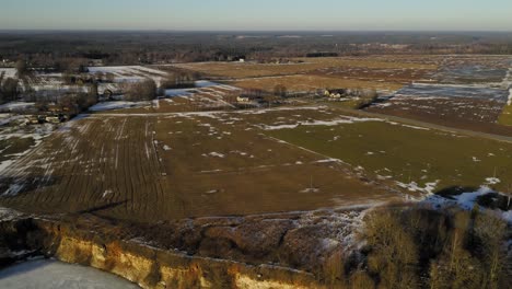 Flying-over-the-quarry-during-winter.-Frozen-water