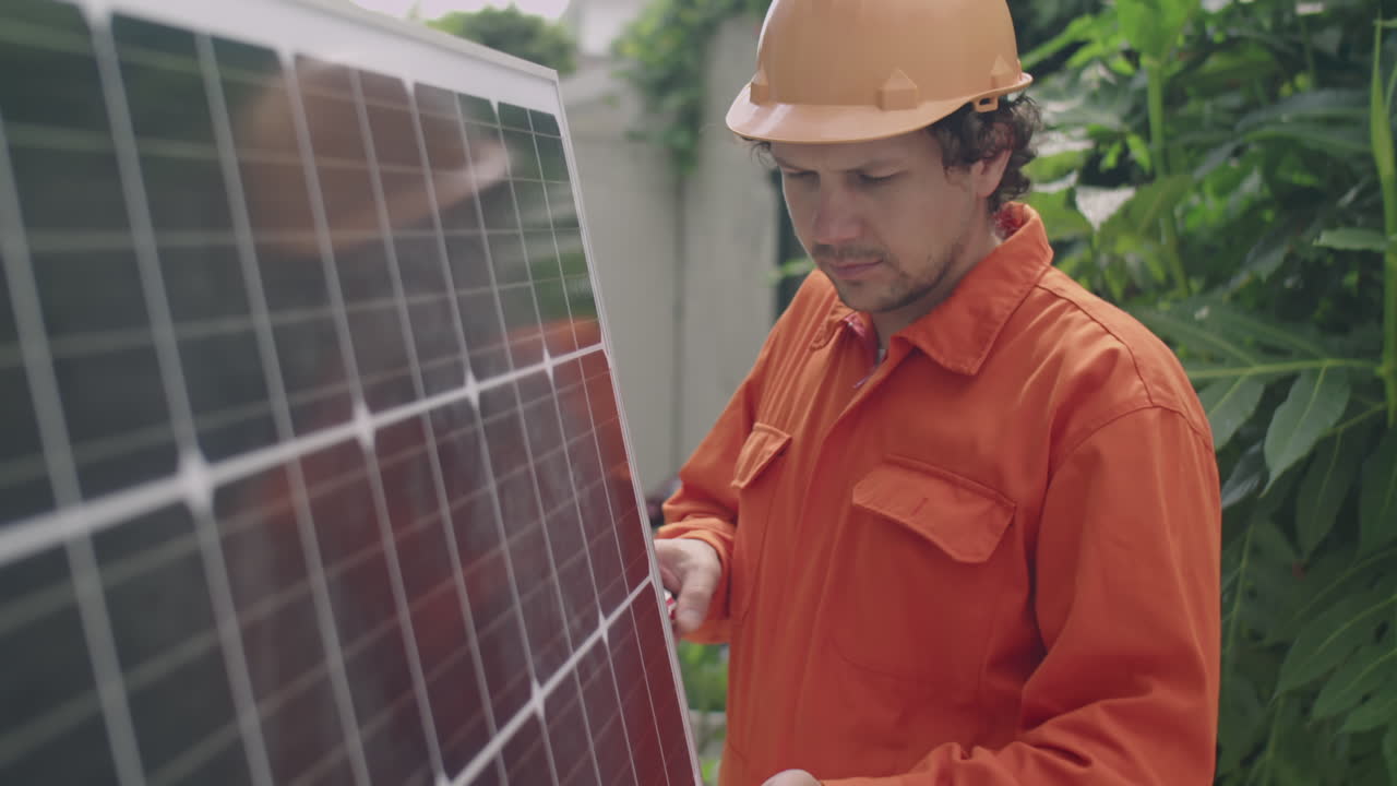 Engineer Installing Solar Panel Outdoors
