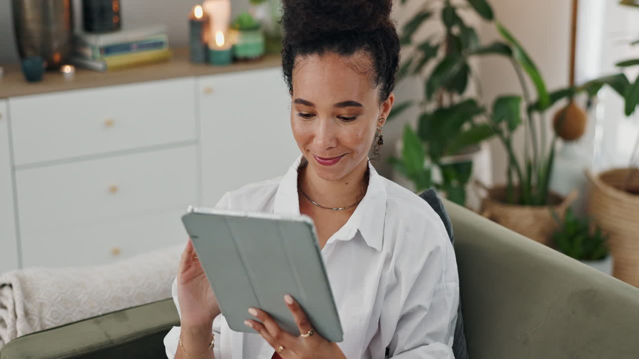 Woman Using Tablet in Cozy Living Room