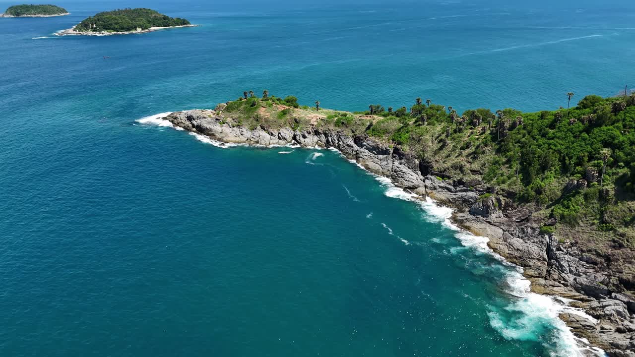 Aerial View of a Tropical Cape with Lush Vegetation and Azure Waters
