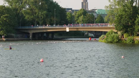 Slow-motion-shot-of-the-outer-alster-lake-with-swimmmers-during-Ironman-in-Hamburg