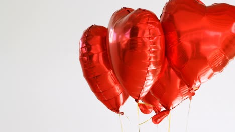 red balloons floating in the air 4k