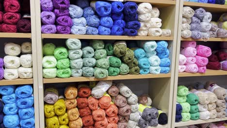 woolen threads of different colors in the store on the shelf woolen threads of different colors in the store on the shelf