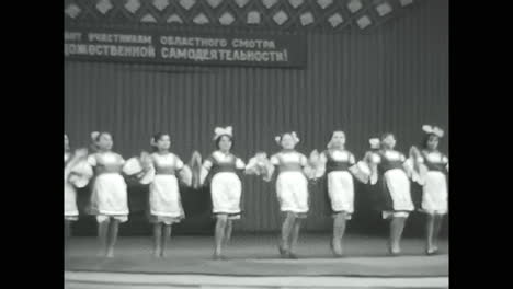 group of soviet children dancing in black and white. circa ussr 1970: group of soviet children dancing in black and white