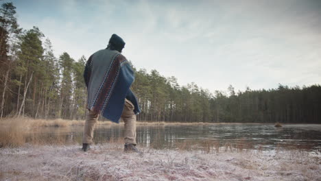 cinematic tracking shot of an ice bather doing qigong, tai chi before cold water exposure