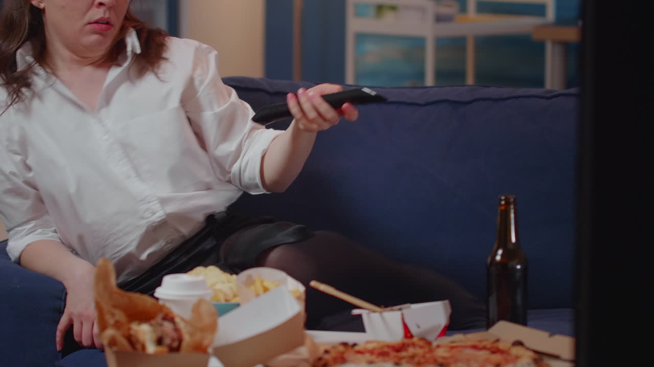 Close up of woman relaxing on couch after eating dinner