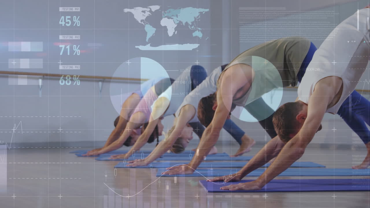 group practicing downward dog in yoga studio, showing animated health pie charts graphs world map