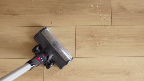 a cordless vacuum cleaner on a hardwood floor