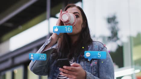 animación de números de redes sociales con iconos sobre mujer caucásica usando teléfono inteligente