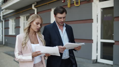 business couple discussing documents. business partners analyzing paperwork