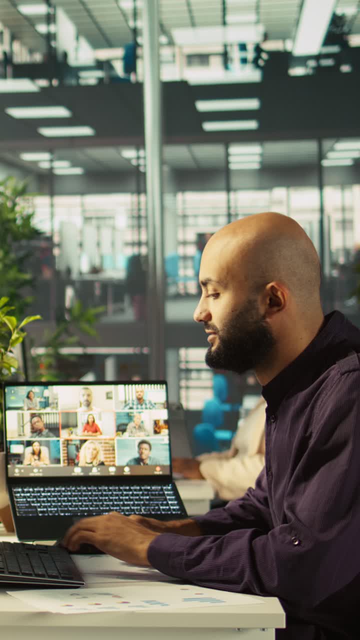 Vertical video Employee having online discussion with coworkers in video call meeting