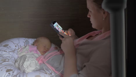 Mother-having-some-time-to-relax-while-baby-is-asleep