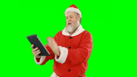 Santa-claus-using-digital-tablet