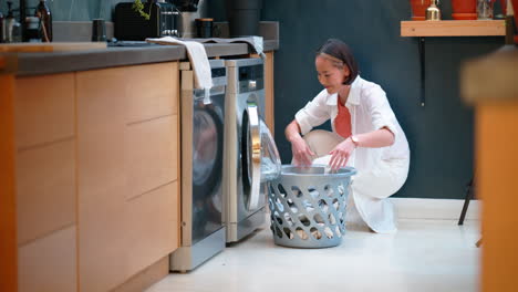 Washing-machine,-laundry-and-woman-cleaning