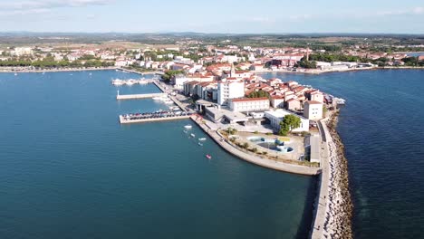 umag at istria, croatia - aerial drone view of the cityscape with port, town center, boulevard and church tower