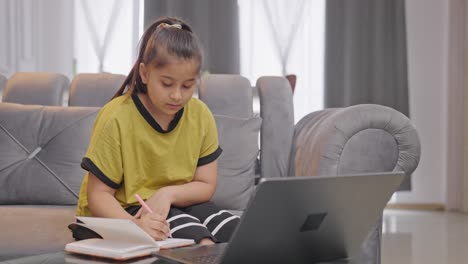 indian kid girl studying from an online course