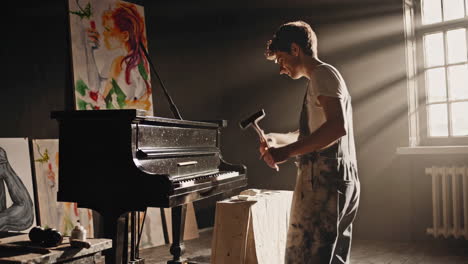 artist repairing a piano in a creative studio